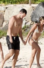 KATIE AUSTIN in Bikini and Lane Armstrong at a Beach in St. Barts 05/16/2024
