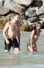KATIE AUSTIN in Bikini and Lane Armstrong at a Beach in St. Barts 05/16/2024