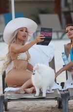 LISA OPIE and ANGEL STRONG in Bikinis at a Beach in Cancun 04/30/2024
