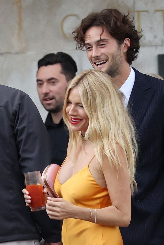 SIENNA MILLER and Oli Green Out in Venice for Wedding of Georgia Irwin and David Winter 05/25/2024