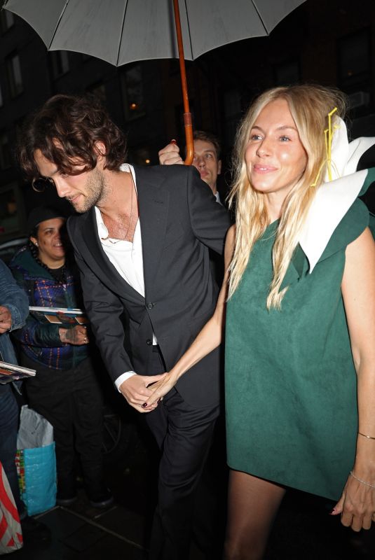SIENNA MILLER Arrives at Anna Wintour