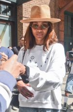 ZOE SALDANA Greets Fans and Signs Autographs as She Leaves Her Hotel in New York 05/01/2024