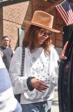 ZOE SALDANA Greets Fans and Signs Autographs as She Leaves Her Hotel in New York 05/01/2024