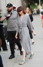DAKOTA JOHNSON in a Robe on the Set of Materialists in New York 06/04/2024