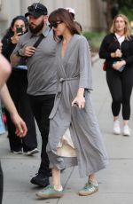DAKOTA JOHNSON in a Robe on the Set of Materialists in New York 06/04/2024