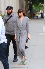 DAKOTA JOHNSON in a Robe on the Set of Materialists in New York 06/04/2024