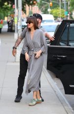 DAKOTA JOHNSON in a Robe on the Set of Materialists in New York 06/04/2024