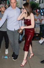 EMMA STONE in a Cherry Red Leather Dress Out in New York 06/21/2024