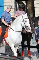 GIGI HADID Riding on Horseback Through Paris 06/22/2024