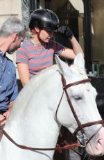 GIGI HADID Riding on Horseback Through Paris 06/22/2024