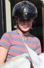 GIGI HADID Riding on Horseback Through Paris 06/22/2024