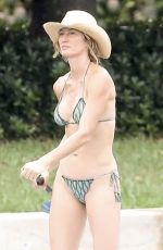 GISELE BUNDCHEN in Bikini Paddle Boarding in Miami 06/15/2024