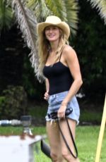 GISELE BUNDCHEN Out eith Her Dog on Father