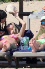 HEIDI KLUM in Bikini at a Beach in Sardinia 06/26/2024