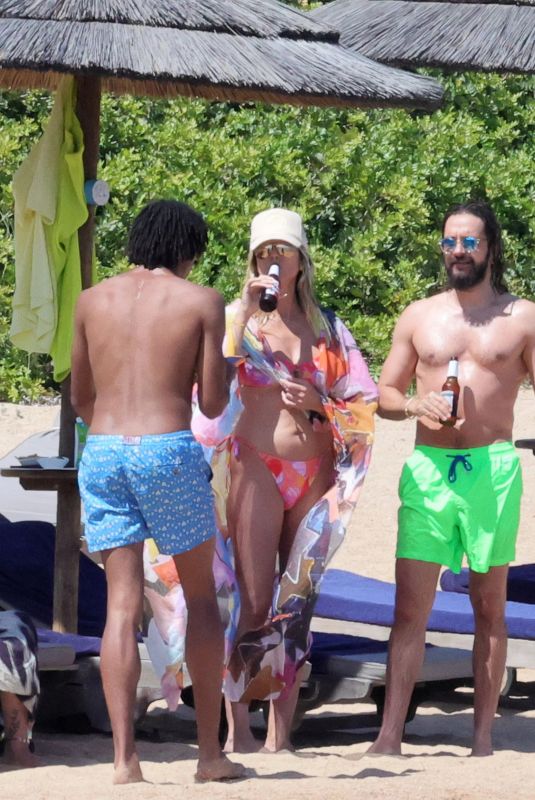 HEIDI KLUM in Bikini at a Beach in Sardinia 06/26/2024