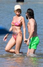 HEIDI KLUM in Bikini on the Beach in Sardinia 06/26/2024