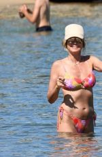 HEIDI KLUM in Bikini on the Beach in Sardinia 06/26/2024