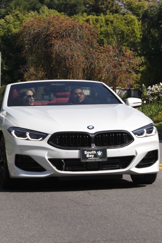 JENNIFER LOPEZ Out Cruising with a Friend in a BMW 8 Series Convertible in Los Angeles 06/04/2024