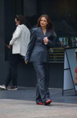 KATIE HOLMES in a Stylish Pantsuit and Red Heels Meeting with a Friend in New York 06/11/2024
