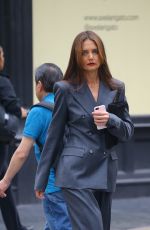KATIE HOLMES in a Stylish Pantsuit and Red Heels Meeting with a Friend in New York 06/11/2024