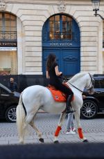 KENDALL JENNER Riding on Horseback Through Paris 06/22/2024