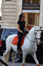 KENDALL JENNER Riding on Horseback Through Paris 06/22/2024