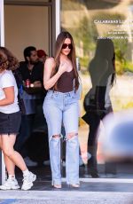 KHLOE KARDASHIAN Filming with Scott Disick at His Calabasas Luxury Motors Dealership in Calabasas 06/26/2024