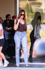 KHLOE KARDASHIAN Filming with Scott Disick at His Calabasas Luxury Motors Dealership in Calabasas 06/26/2024