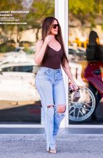 KHLOE KARDASHIAN Filming with Scott Disick at His Calabasas Luxury Motors Dealership in Calabasas 06/26/2024