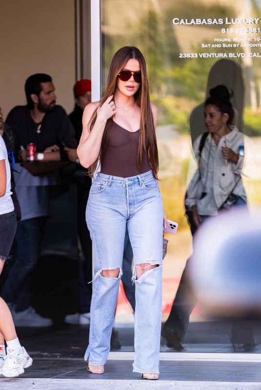 KHLOE KARDASHIAN Filming with Scott Disick at His Calabasas Luxury Motors Dealership in Calabasas 06/26/2024