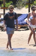 LENI KLUM in a White Bikini at a Beach in Sardinia 06/26/2024