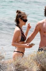 LENI KLUM ina Colorful Bikini at a Beach in Sardinia 06/19/2024