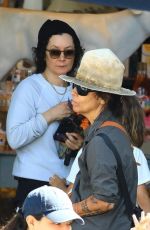 LINDA PERRY and SARA GILBERT Shopping at Farmers Market in Studio City 06/16/2024