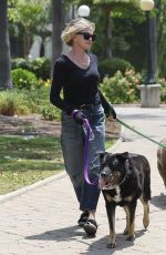 MELANIE GRIFFITH Out with Her Fogs at a Park in Beverly Hills 06/18/2024