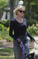 MELANIE GRIFFITH Out with Her Fogs at a Park in Beverly Hills 06/18/2024