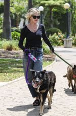 MELANIE GRIFFITH Out with Her Fogs at a Park in Beverly Hills 06/18/2024