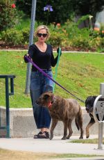 MELANIE GRIFFITH Out with Her Fogs at a Park in Beverly Hills 06/18/2024