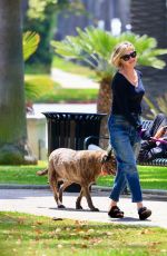 MELANIE GRIFFITH Out with Her Fogs at a Park in Beverly Hills 06/18/2024