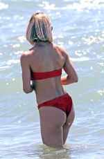 MICHELLE HUNZIKER in a Red Bikini at Alpemare Beach in Forte Dei Marmi 06/03/2024