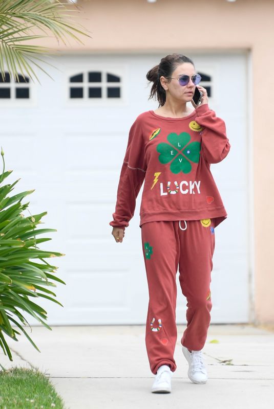MILA KUNIS Dropping by a Friends House in Los Angeles 05/29/2024