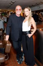 OLIVIA WILDE at Michael Kors Celebrates New Rodeo Drive Store in Los Angeles 06/04/2024