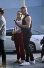 OLIVIA WILDE Out with a Mystery Guy in line at Hamburger Mary