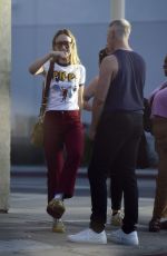 OLIVIA WILDE Out with a Mystery Guy in line at Hamburger Mary