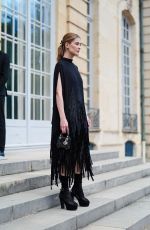ROSAMUND PIKE Arrives aat Dior Fall 2024 Couture Show in Paris 06/24/2024