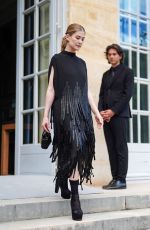 ROSAMUND PIKE Arrives aat Dior Fall 2024 Couture Show in Paris 06/24/2024