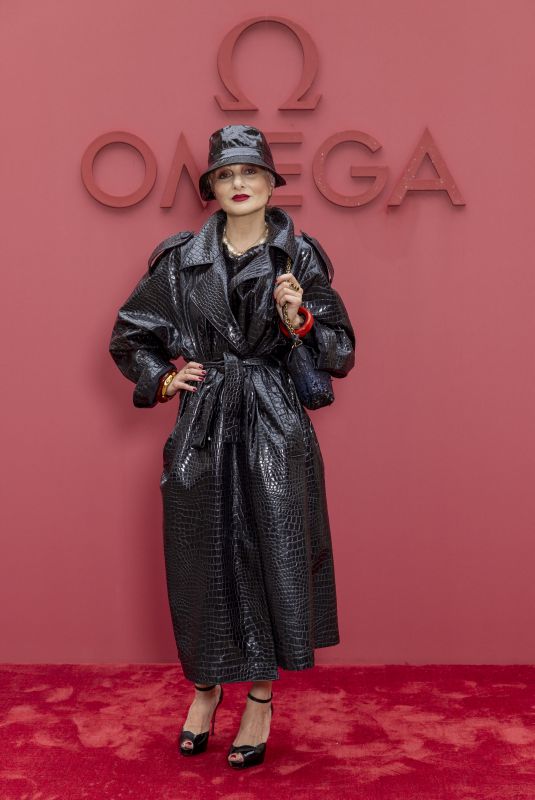 CATHERINE BABA at Opening Night of Omega House in Paris 07/27/2024