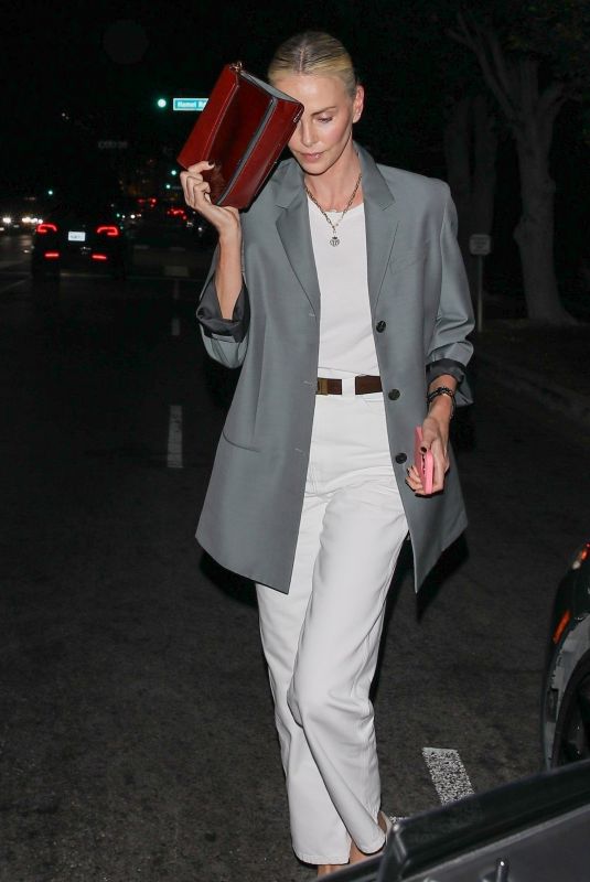 CHARLIZE THERON Leaves Dinner at A.O.C. Restaurant in Los Angeles 07/10/2024