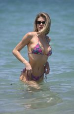 CHARLOTTE MCKINNEY in Bikini at a Beach in Miami 06/28/2024