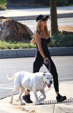 CHRISTINA HALL Out with Her Dog Around Her Neighborhood in Los Angeles 07/26/2024