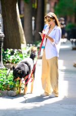 EMILY RATAJKOWSKI Takes Her Dog for a Walk in New York 07/26/2024